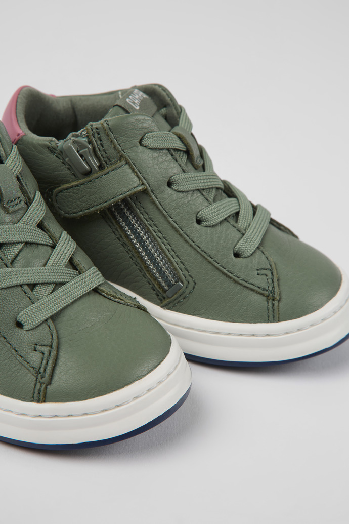 Close-up view of Twins Green leather sneakers for kids