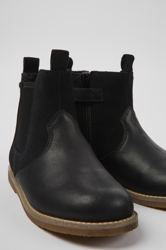 Close-up view of Savina Black nubuck and leather ankle boots for kids