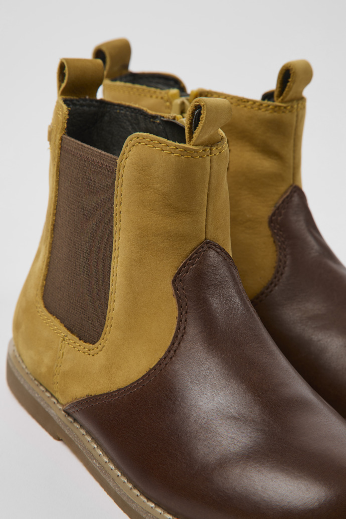 Close-up view of Savina Brown nubuck and leather ankle boots for kids