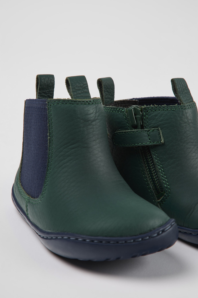 Close-up view of Peu Green and blue leather boots for kids