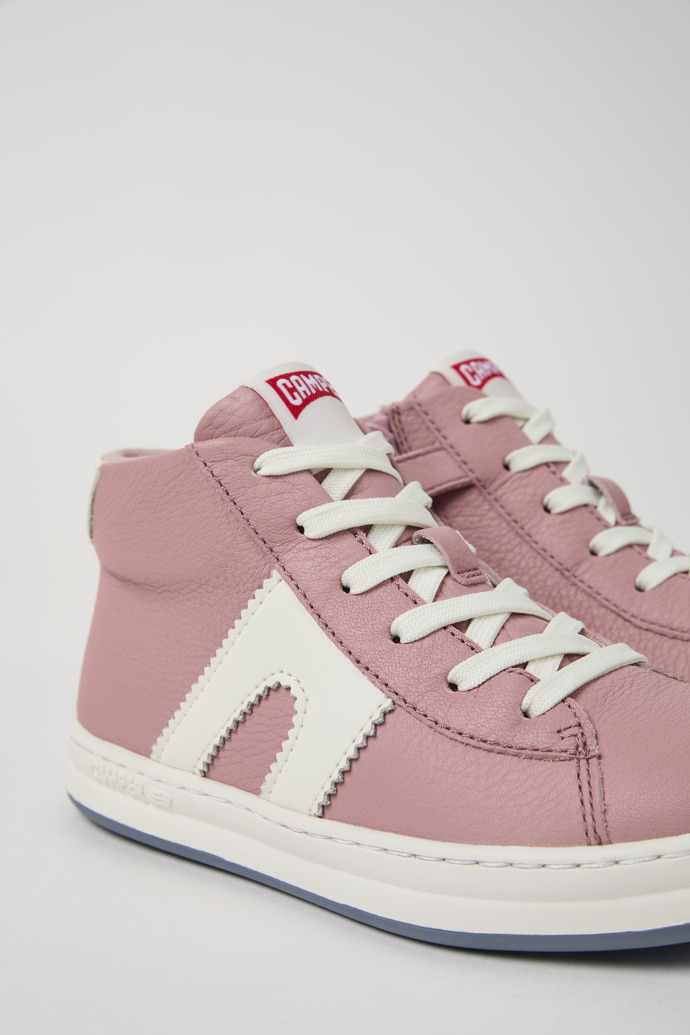 Close-up view of Runner Pink and white recycled leather sneakers for kids