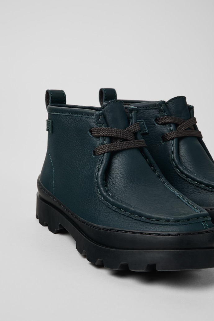 Close-up view of Brutus Green leather ankle boots for kids