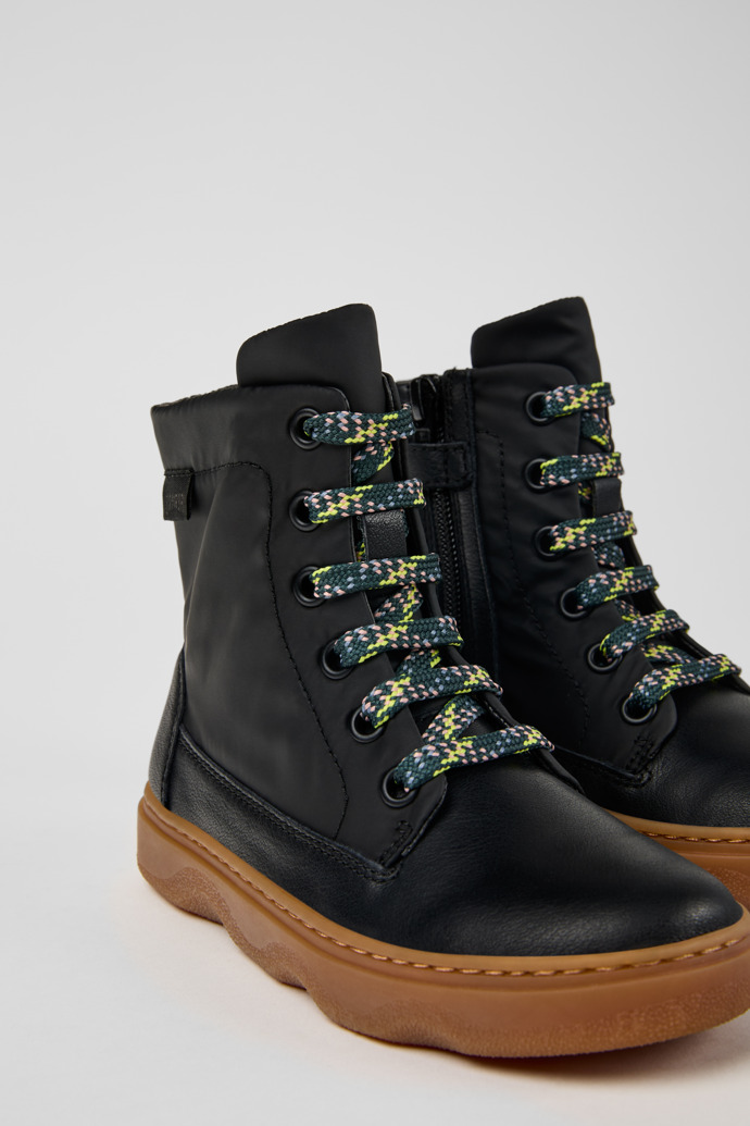 Close-up view of Kiddo Black leather and textile ankle boots for kids