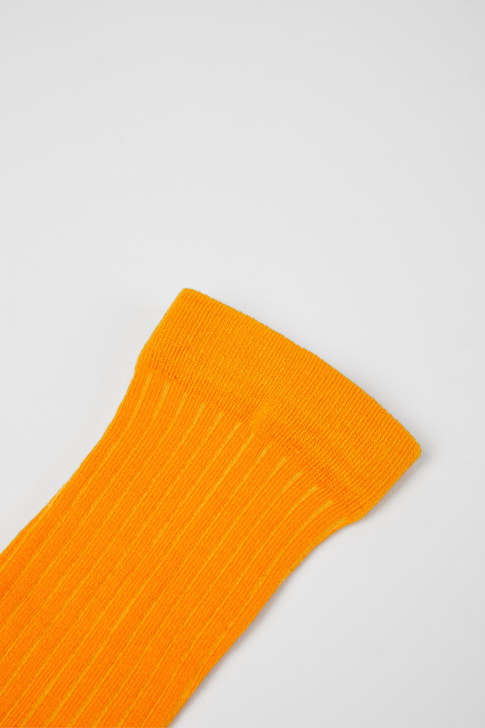 Close-up view of Calma Socks PYRATEX® Orange socks in collaboration with PYRATEX®
