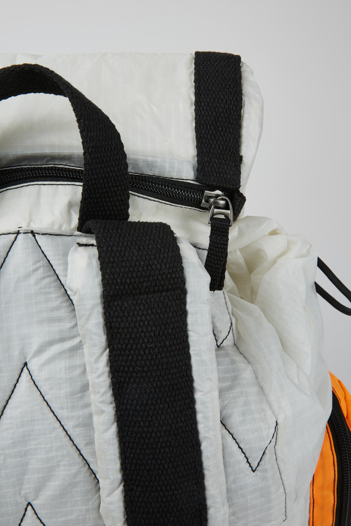 Close-up view of Camper x North Sails White and orange backpack