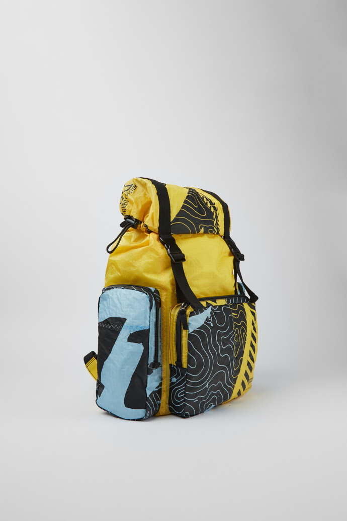 Front view of Camper x North Sails Yellow, black, and blue backpack