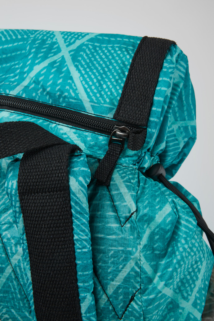 Close-up view of Camper x North Sails Turquoise and beige-green backpack