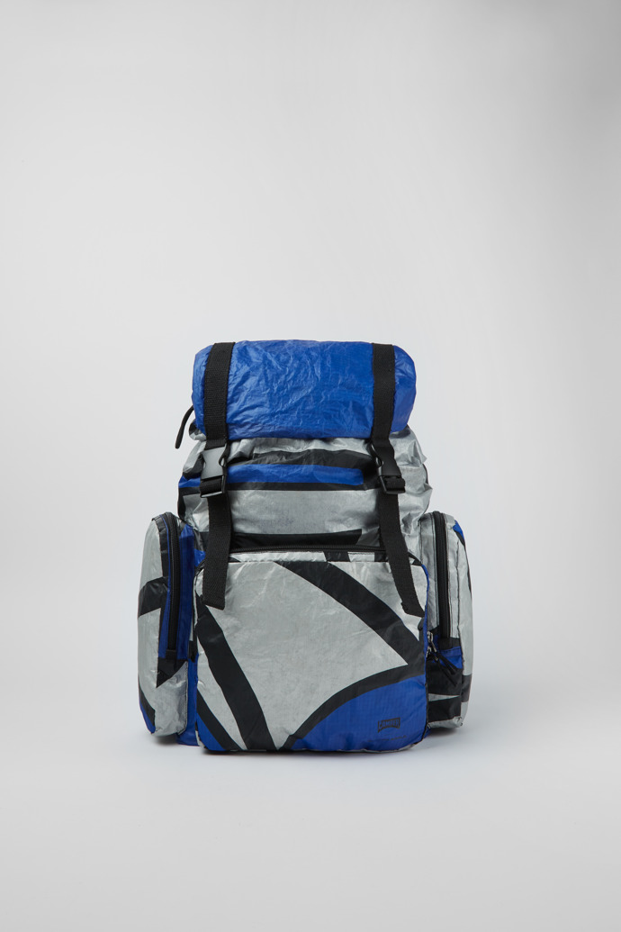 Side view of Camper x North Sails Blue, silver, and black backpack
