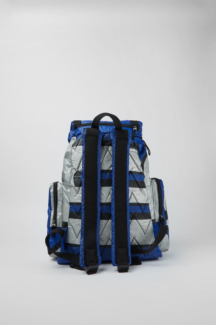 Back view of Camper x North Sails Blue, silver, and black backpack