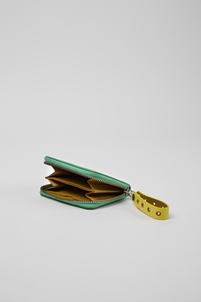 Overhead view of Mosa Green and yellow small leather wallet