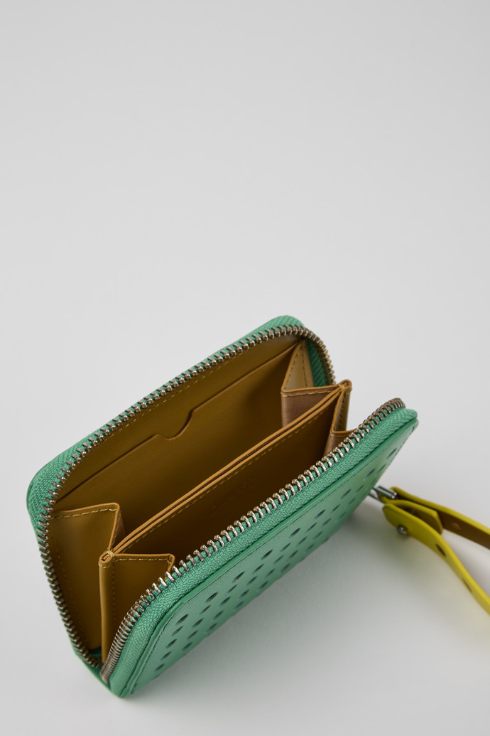 Close-up view of Mosa Green and yellow small leather wallet