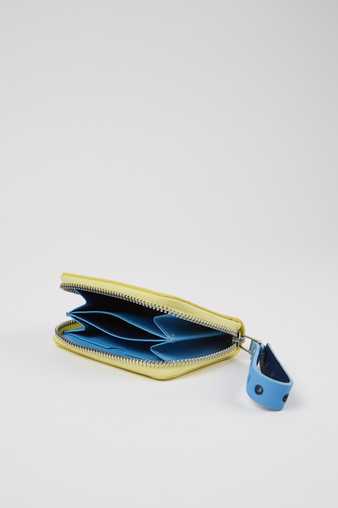 Overhead view of Mosa Yellow and blue small leather wallet