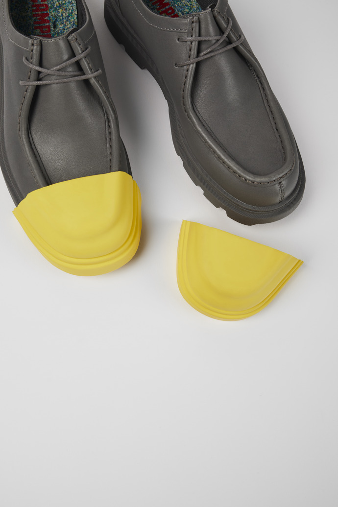 Close-up view of Junction Toe Caps Yellow rubber toe caps