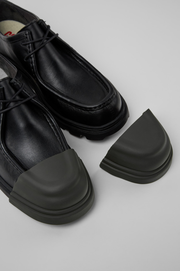 Close-up view of Junction Toe Caps Gray rubber toe caps