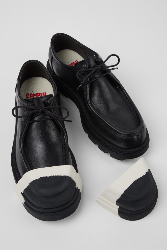 Close-up view of Junction Toe Caps Black and white rubber toe caps