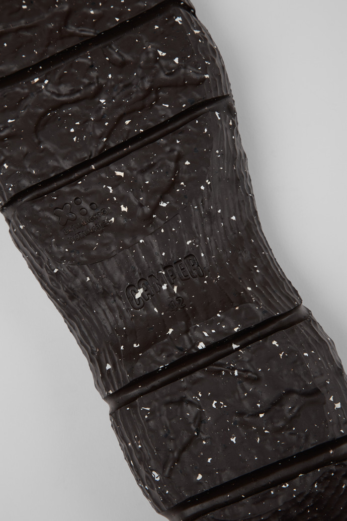 Close-up view of ROKU Outsoles Brown outsoles (x2) for your right and left shoes.