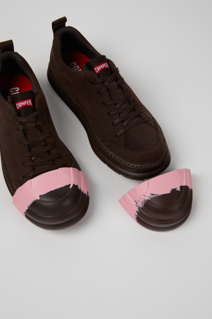 Close-up view of Junction Runner Toe Caps Brown, pink rubber toe caps.