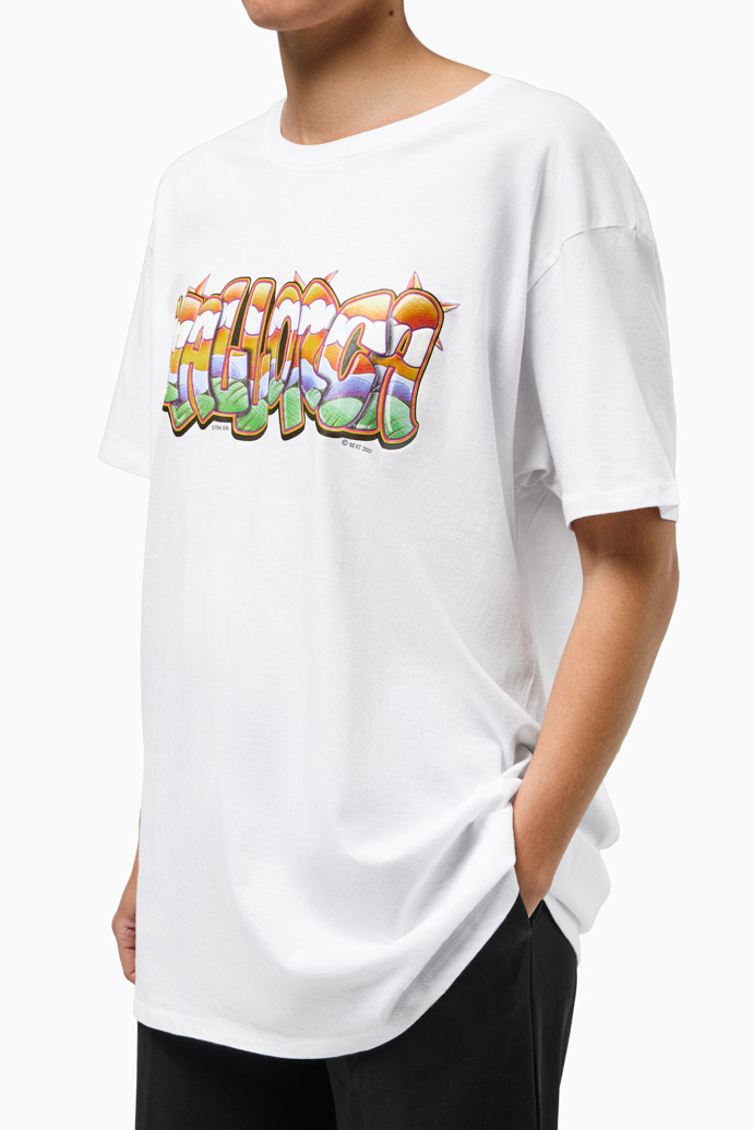 Overhead view of Graffiti Tee Retro souvenir t-shirt with graffiti-style Mallorca lettering