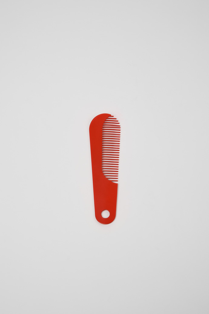 Overhead view of Camper Combi by Martí Guixé Red comb and shoe horn