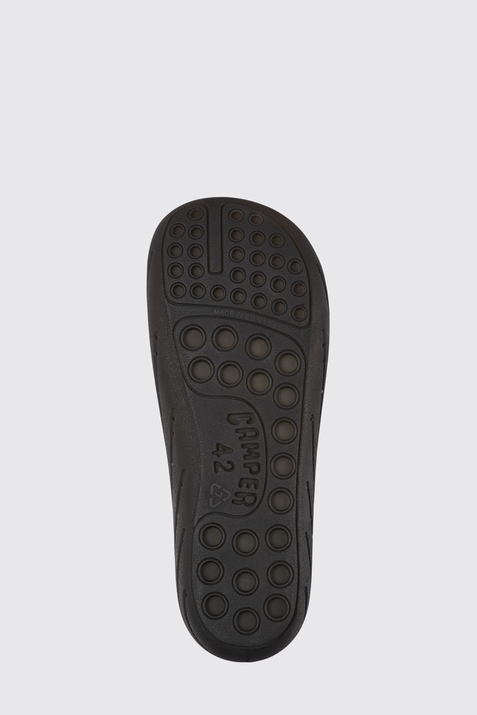 The sole of Wabi Black monomaterial sandals for men