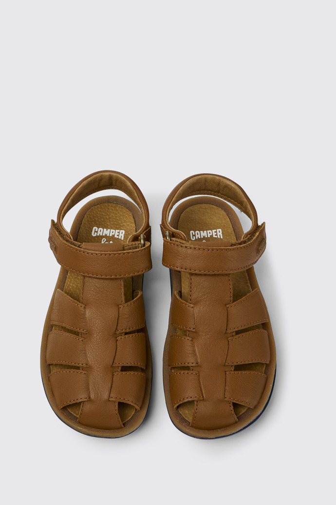 Overhead view of Bicho Brown leather sandals for kids