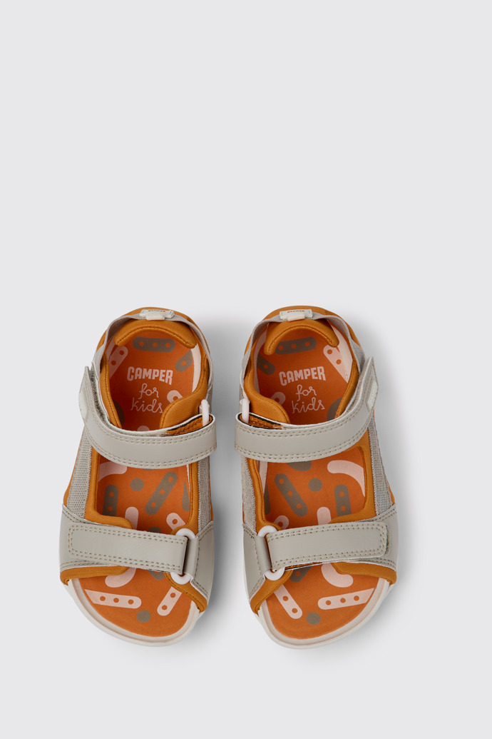 Overhead view of Ous Grey and orange sandals for kids