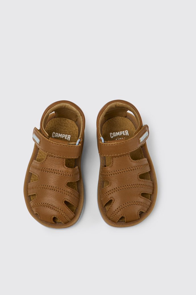 Overhead view of Bicho Brown leather sandals for kids