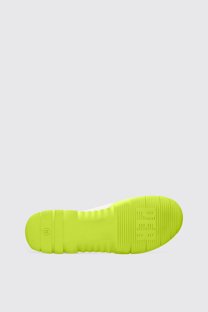 The sole of Nothing Men’s neon yellow, yellow and cream sneaker