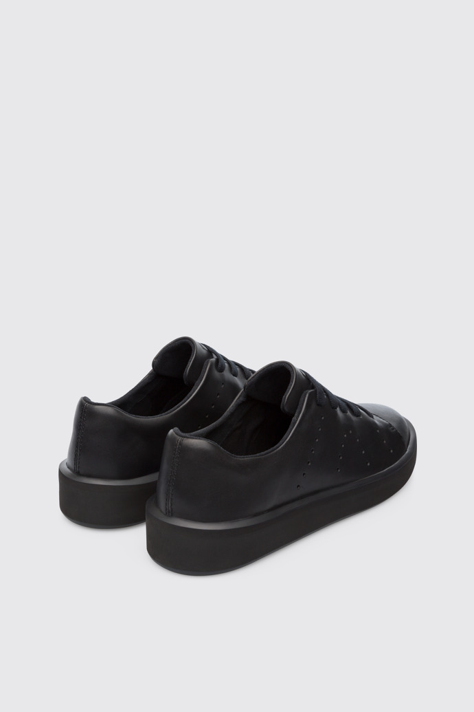 Back view of Courb Men's minimal, soft black sneaker