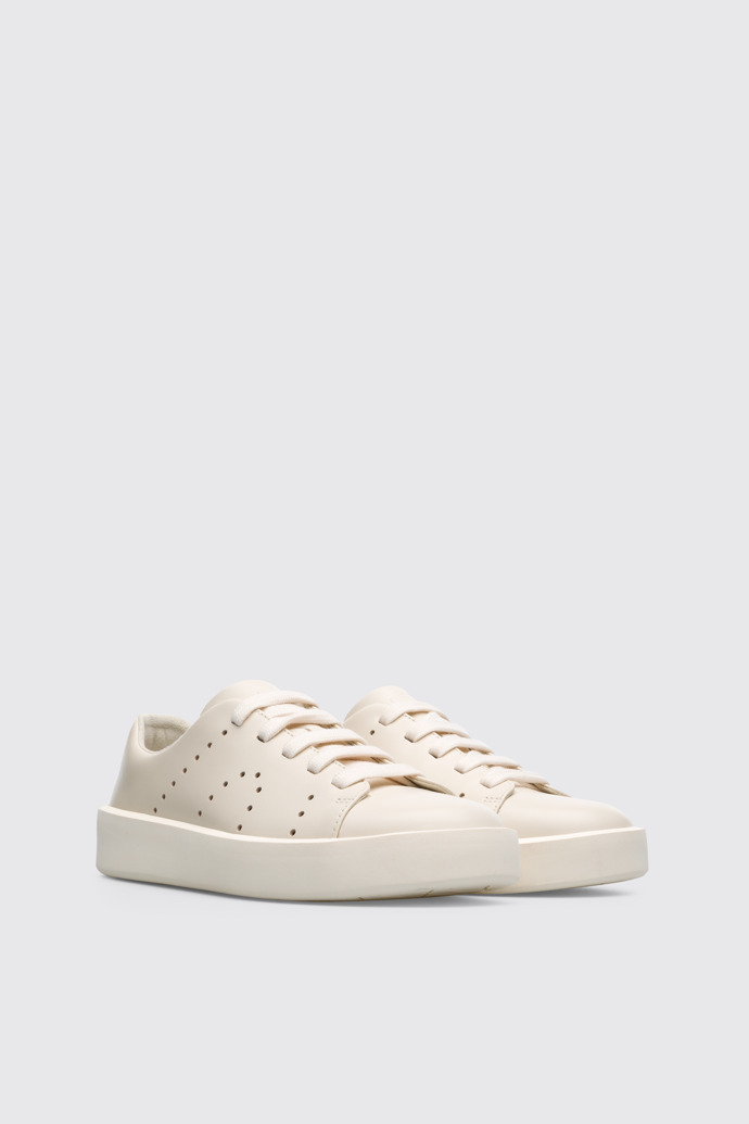 Front view of Courb Cream women's sneaker