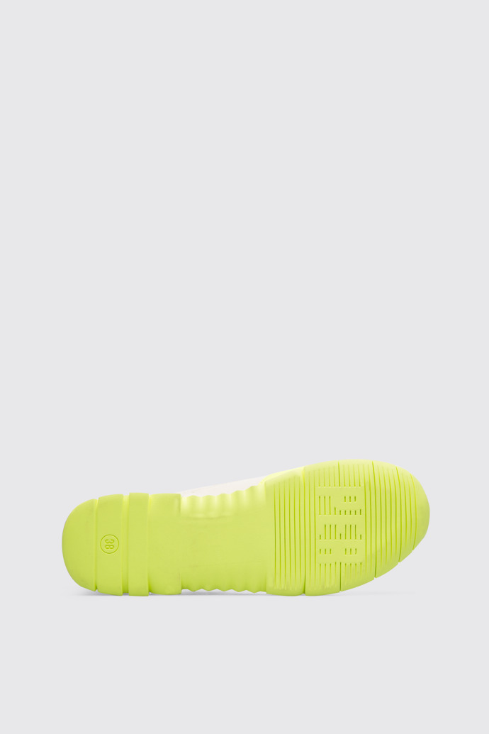 The sole of Nothing Women’s neon yellow sneaker