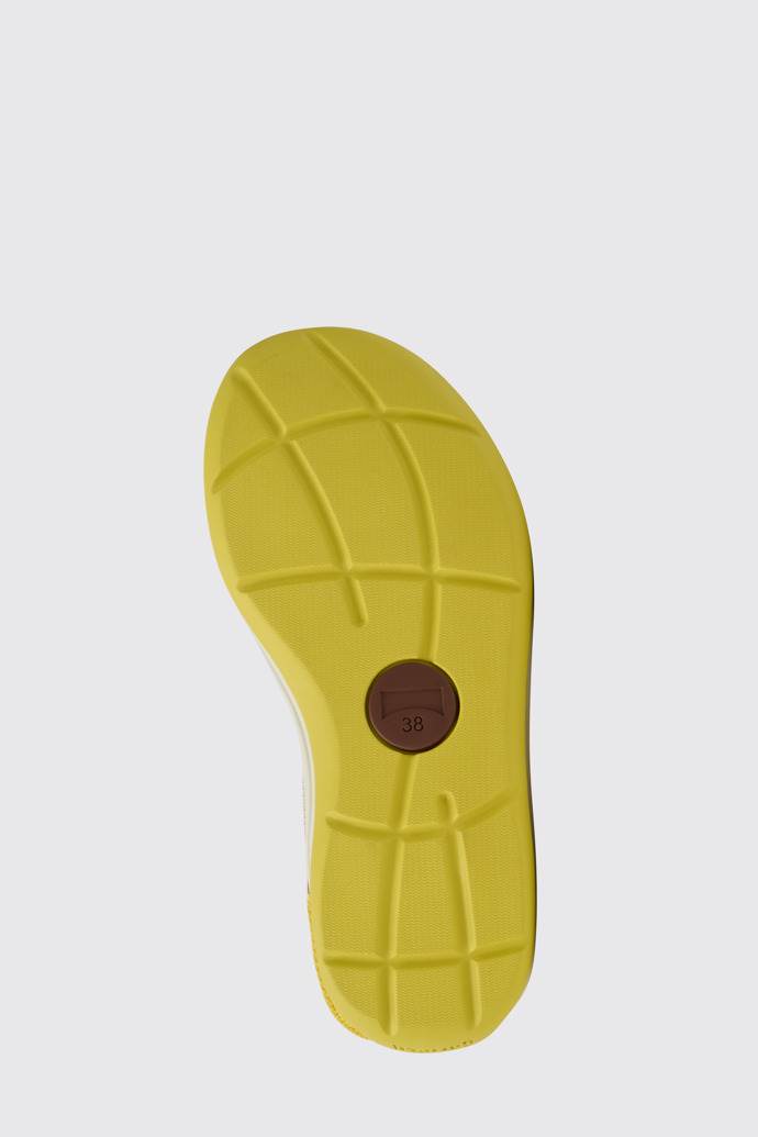 The sole of Match Yellow, white, and brown sandals for women