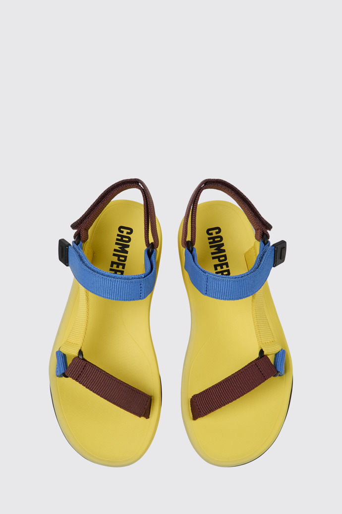 Overhead view of Match Yellow, blue, and burgundy sandals for women