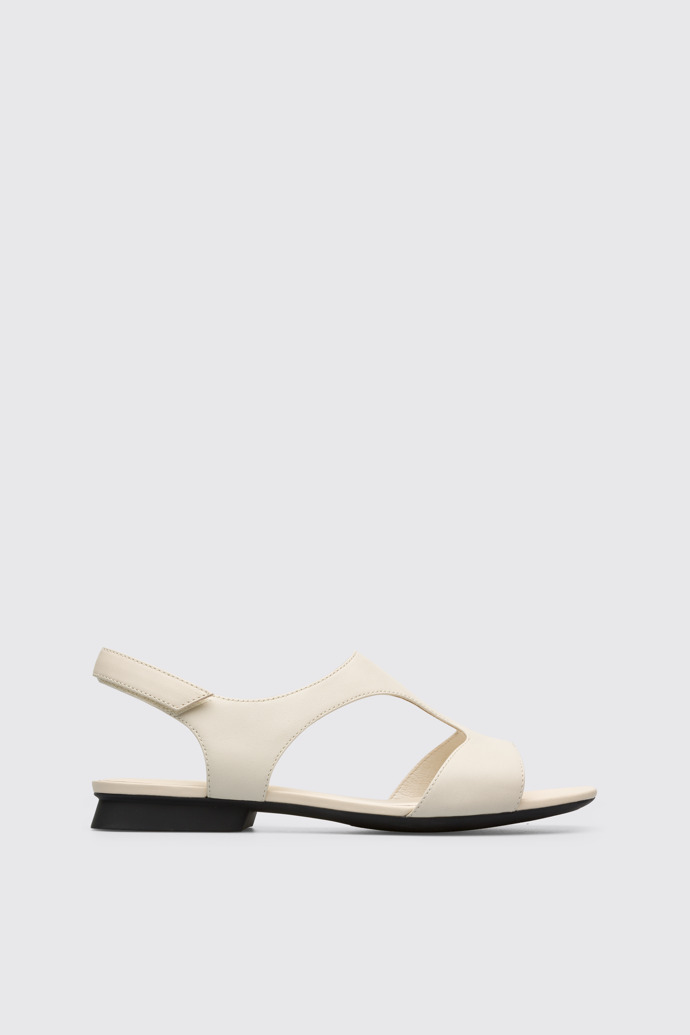 Side view of Casi Myra Women’s cream textile T-strap sandal