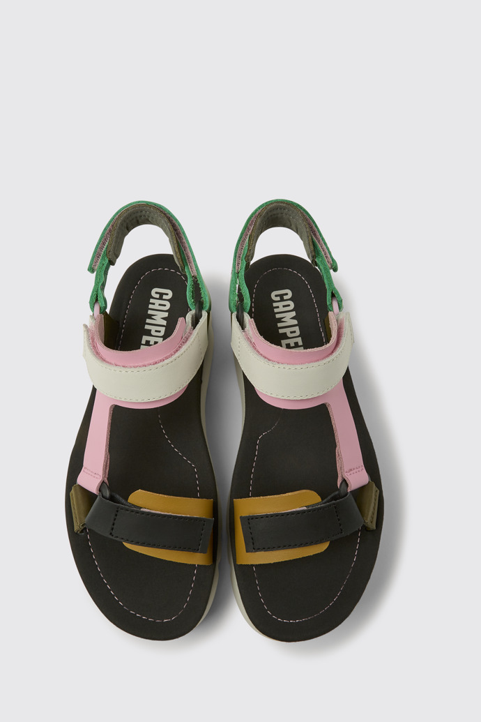 Overhead view of Oruga Up Green, pink, and white leather sandals for women