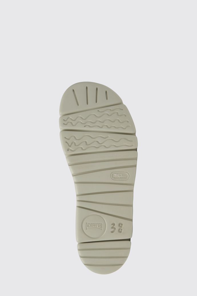 The sole of Oruga Up Green, pink, and white leather sandals for women
