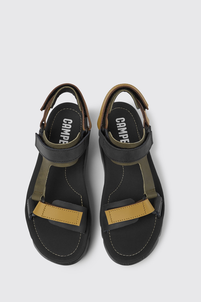 Overhead view of Oruga Up Black, brown, and green leather sandals for women