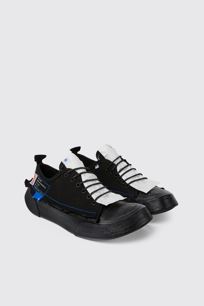 Front view of ADERERROR Black sneakers