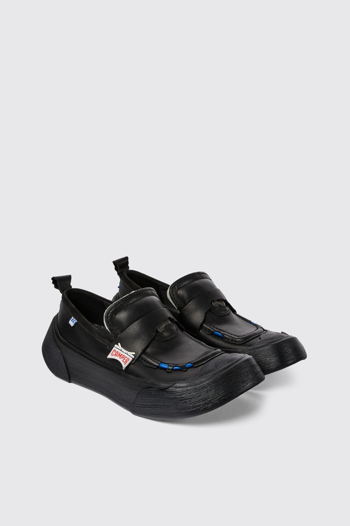 Front view of ADERERROR Black leather shoes