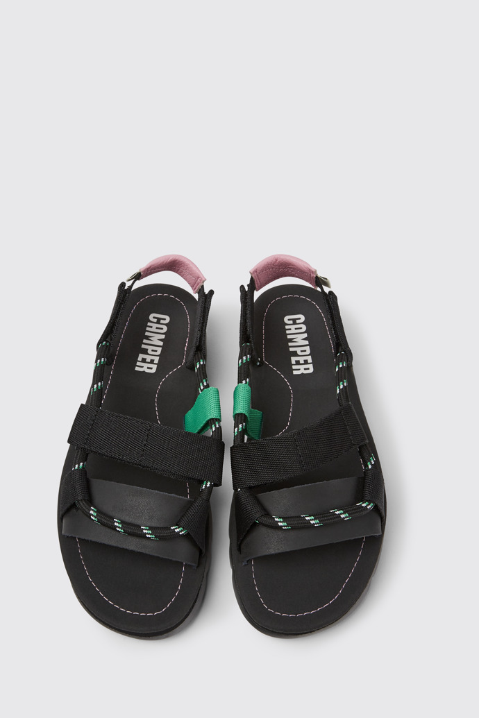 Overhead view of Oruga Black, pink, and green leather sandals for women