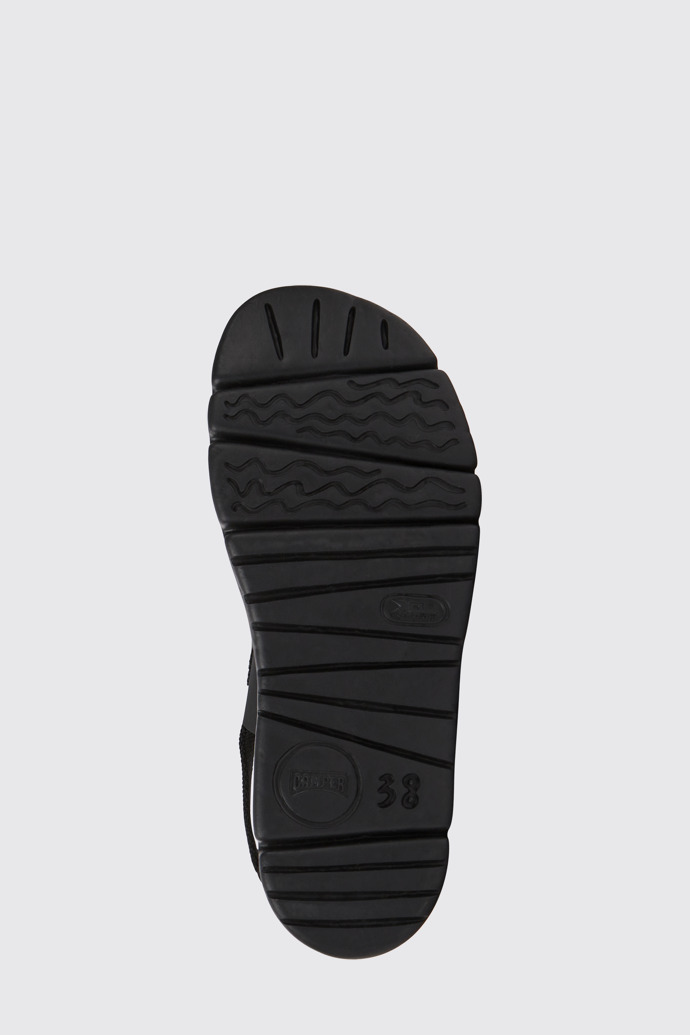 The sole of Oruga Up Black leather sandals for women
