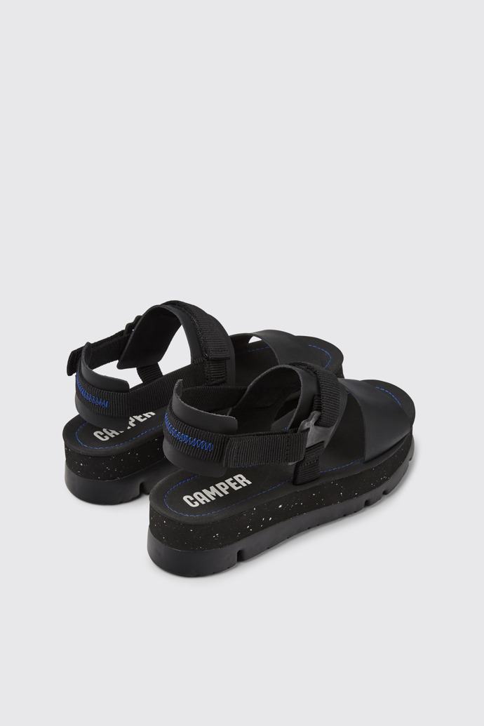 Back view of Oruga Up Black leather sandals for women