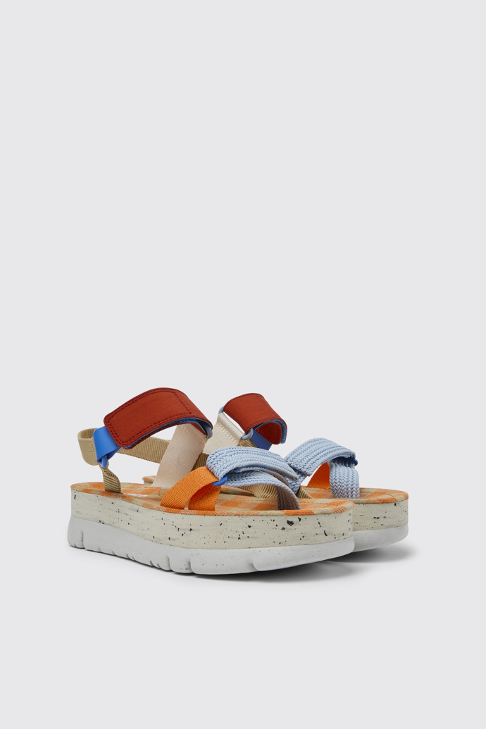 Front view of Oruga Up Beige, blue, and red sandals for women