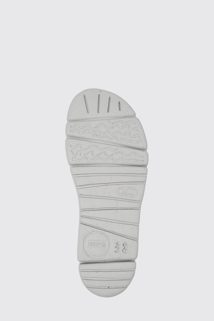 The sole of Oruga Up Beige, blue, and red sandals for women