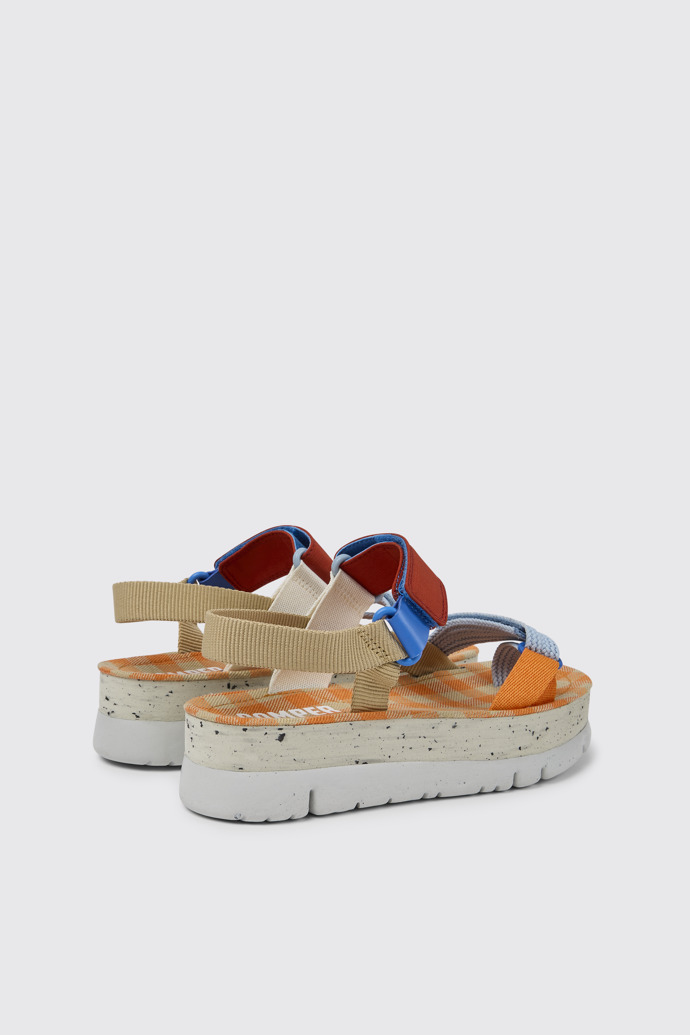 Back view of Oruga Up Beige, blue, and red sandals for women