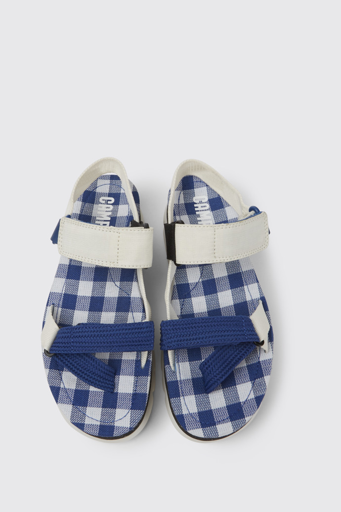 Overhead view of Oruga Up White, blue, and black sandals for women