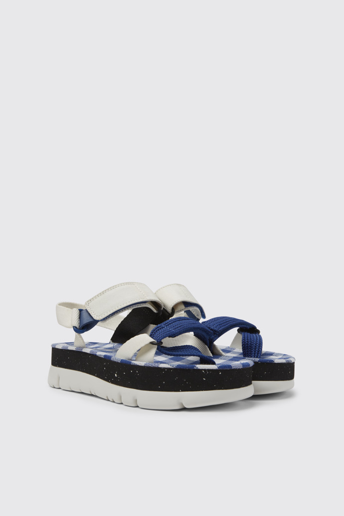 Front view of Oruga Up White, blue, and black sandals for women