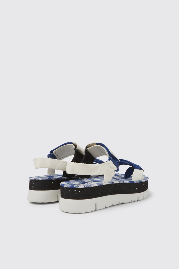 Back view of Oruga Up White, blue, and black sandals for women