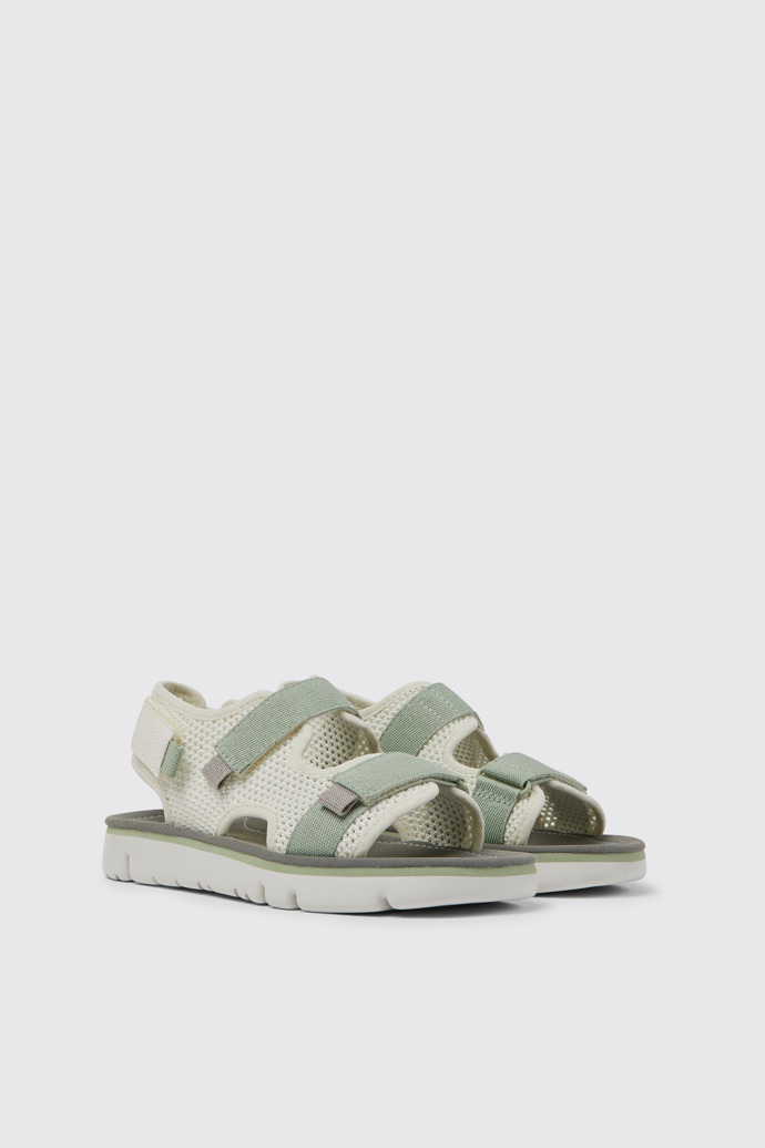 Front view of Oruga White, green, and grey sandals for women
