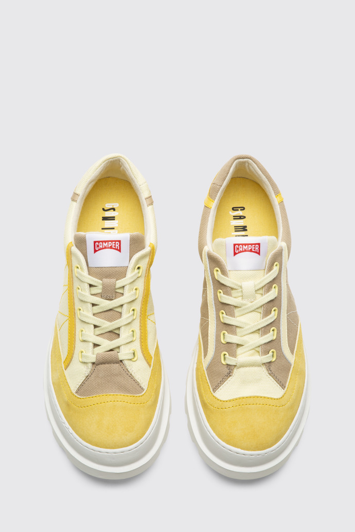Overhead view of Twins Yellow and beige lace-up sneakers